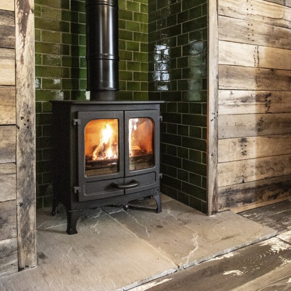 Charnwood Island I in Black on Low Legs - Lifestyle Image in a Green Tiled Fireplace