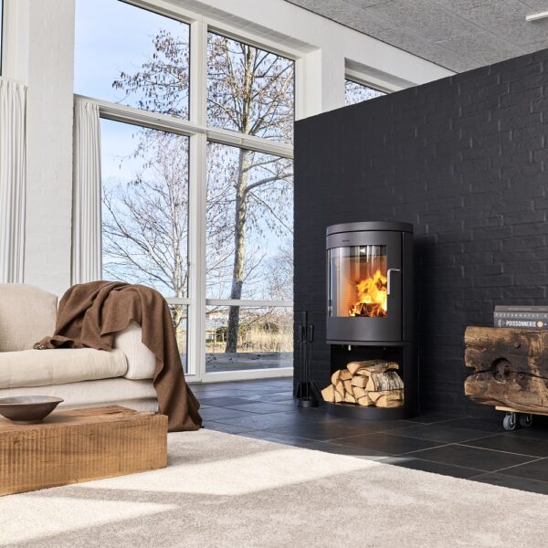 Morso 8643 Wood-Burning Stove - Freestanding Lifestyle Image against a brick wall