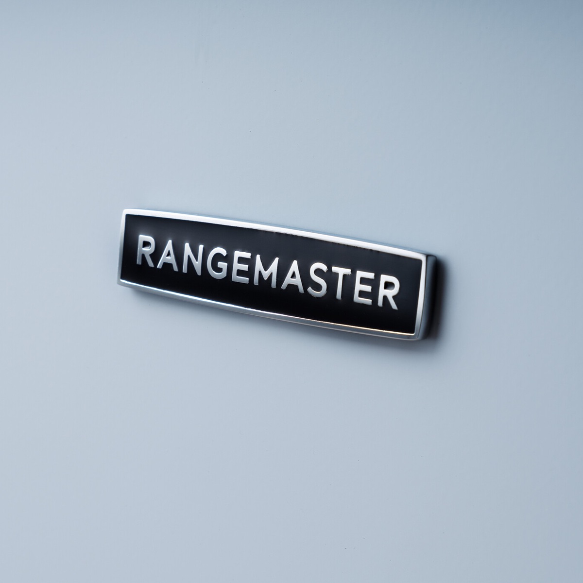 RangemasterClassic90-Ind-MistyBlue-BadgeDetail Rangemaster Classic 90 Next-Generation Range Cooker - Misty Blue with Chrome Trim - Induction - Badge Detail
