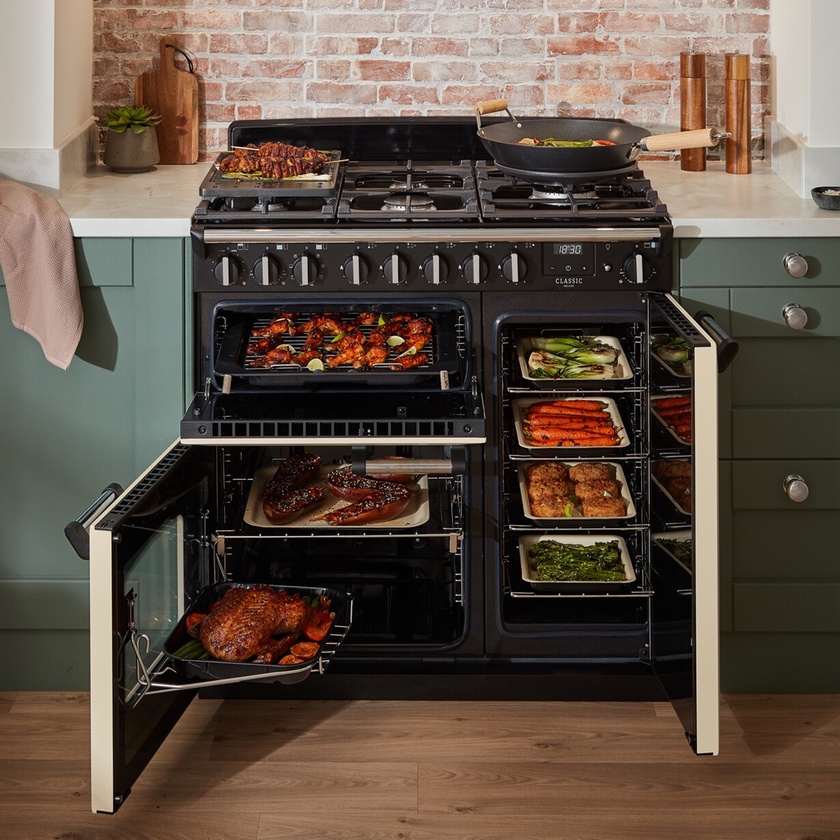 RangemasterClassicDeluxe90NGC-DF-PaleCreamChrome-CookingLifestyle Rangemaster Classic Deluxe 90 Next-Generation Range Cooker - Pale Cream with Chrome Trim - Dual Fuel - Fully Loaded Food Lifestyle Image