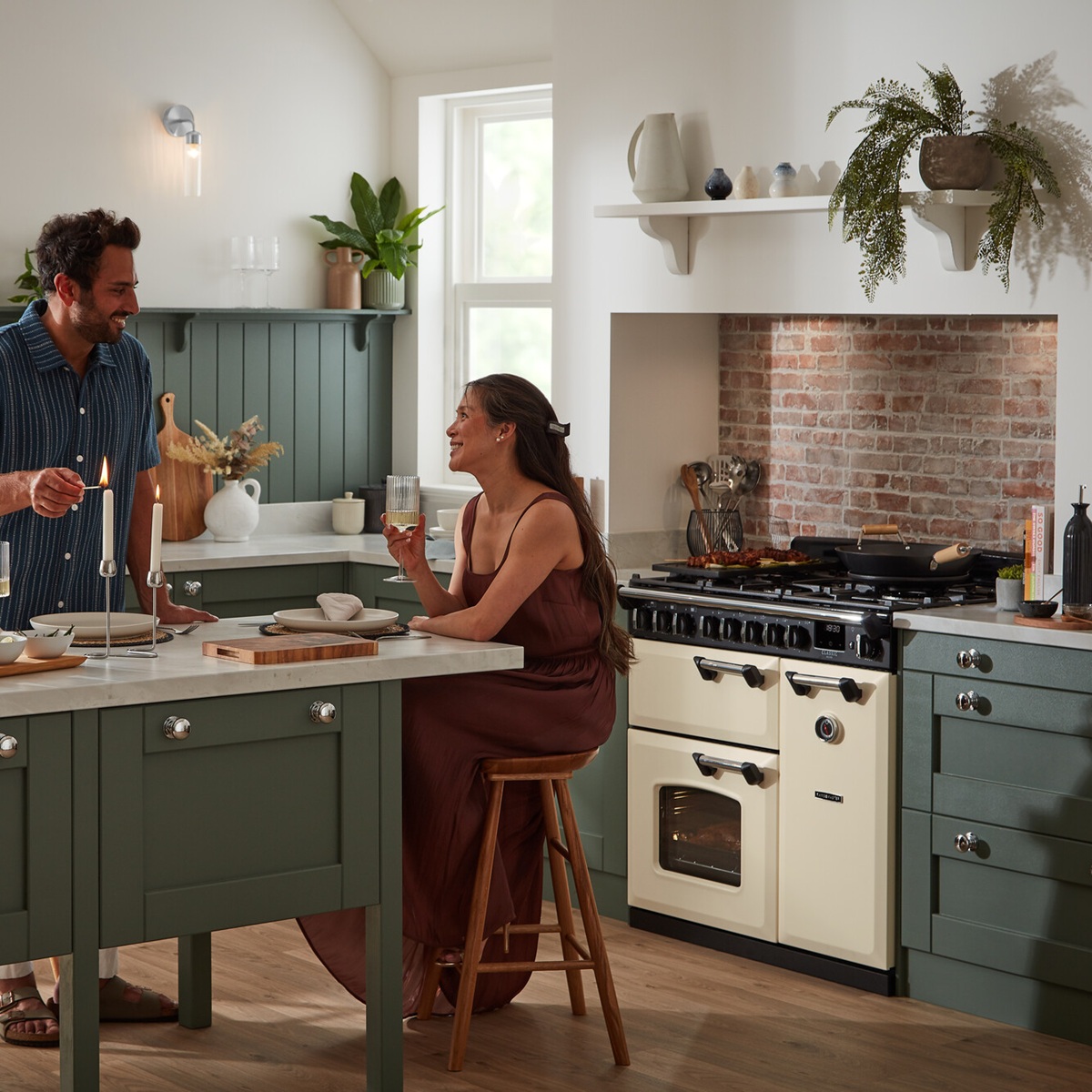 RangemasterClassicDeluxe90NGC-DF-PaleCreamChrome-DateLifestyle Rangemaster Classic Deluxe 90 Next-Generation Range Cooker - Pale Cream with Chrome Trim - Dual Fuel - Date Night Lifestyle Image