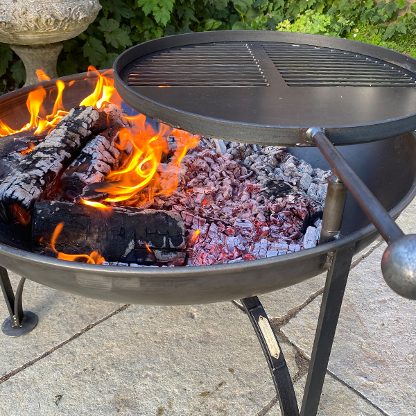 Plain Jane Fire Pit with Swing Arm - 50cm, 60cm and 70cm Variations. Lifestyle Image Showing a Large Fire