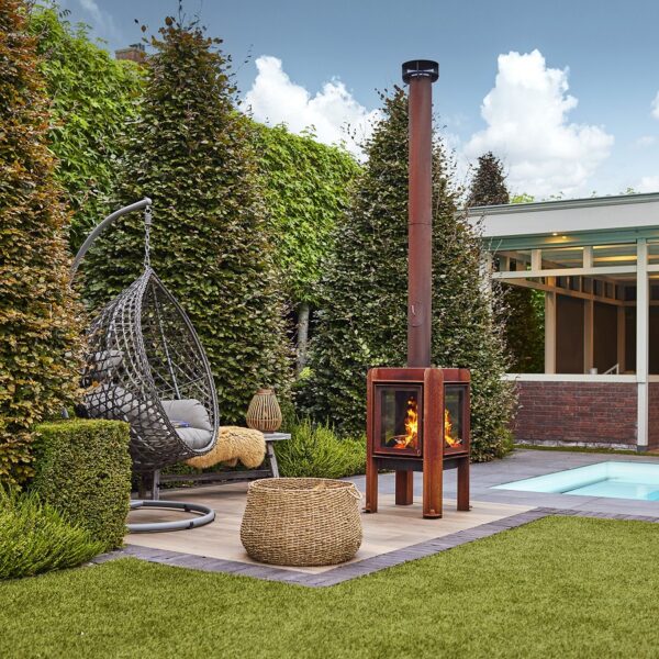 RB73 Fennek 50 Outdoor Stove Lifestyle Image Poolside with Hanging Chair