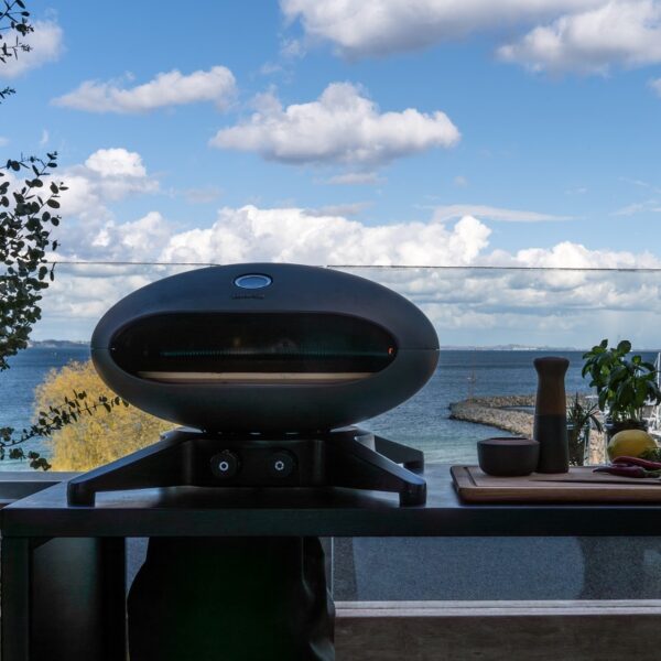 Morsø Forno Spin - Marina Lifestyle Image on Large Garden Table.