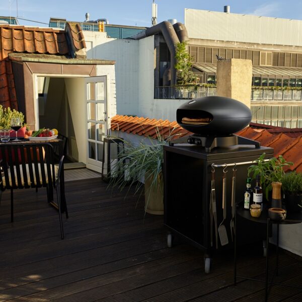 Morsø Forno Spin - Rooftop Terrace Lifestyle Image with Terra Table and Utensils.