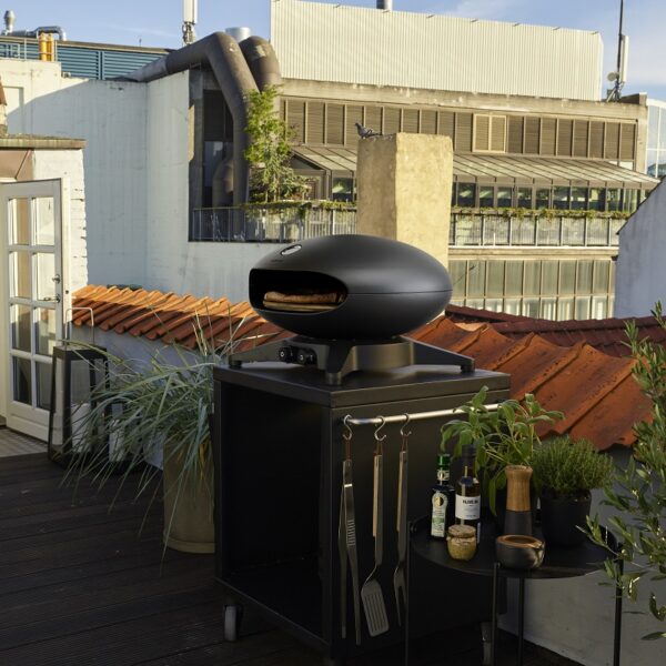 Morsø Forno Spin Pizza Lovers Package - Rooftop Terrace Lifestyle Image Cooking Pizza