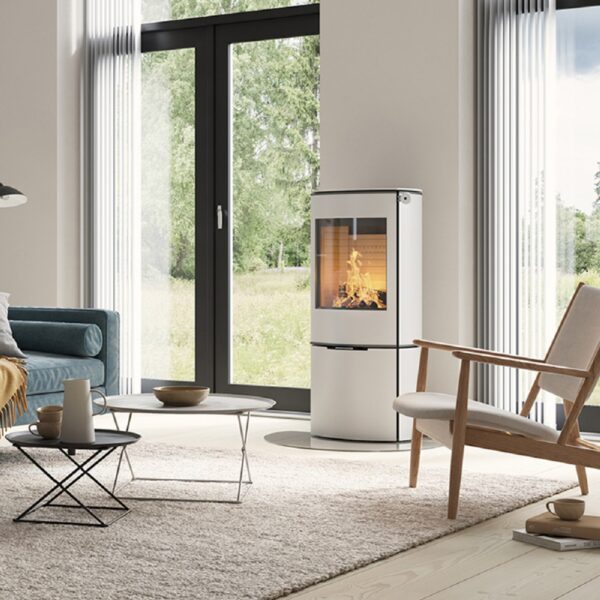 RAIS Caro 110 Wood-Burning Stove in White - Lifestyle Image with Steel Door and White Corian Handle