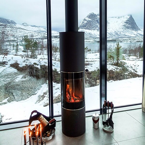 RAIS Pilar Wood-Burning Stove - Lifestyle Image in Black with Winter Landscape