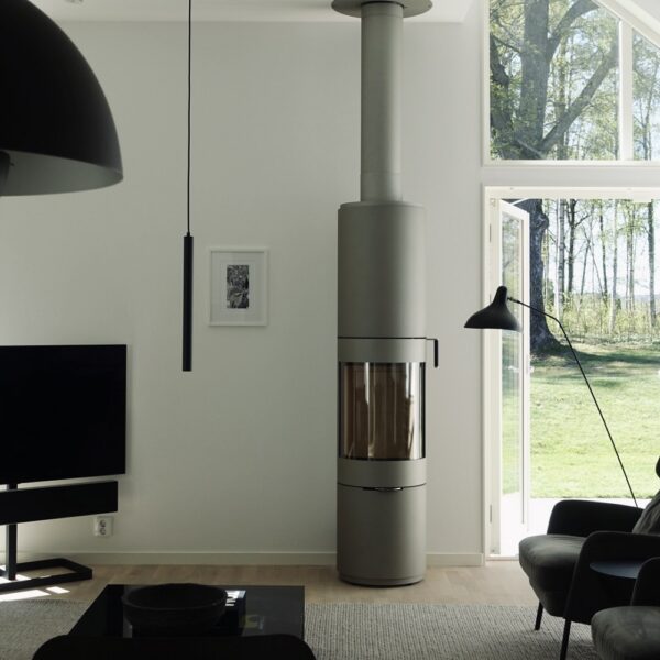 RAIS Pilar Wood-Burning Stove - Lifestyle Image in Platinum with Steel Door