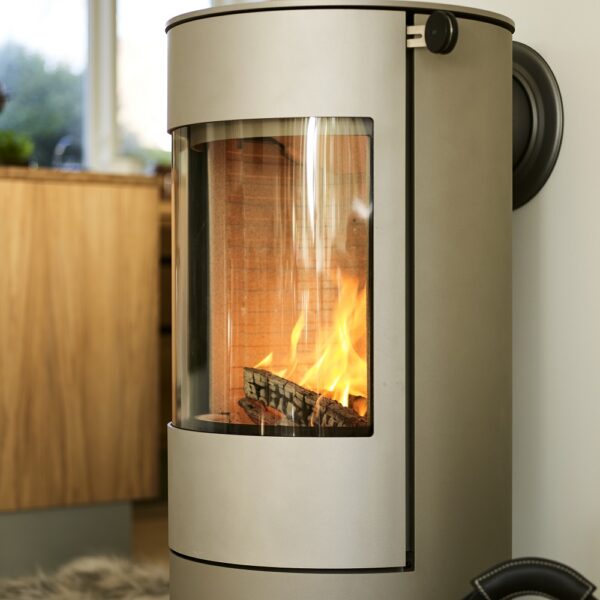 RAIS Viva L 100 Wood-Burning Stove - Lifestyle Image in Nickel with Steel Door