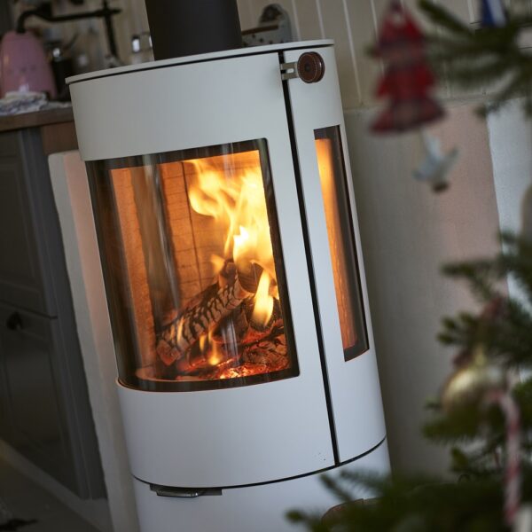 RAIS Viva L 100 Wood-Burning Stove - Lifestyle Image in White with Christmas Decor