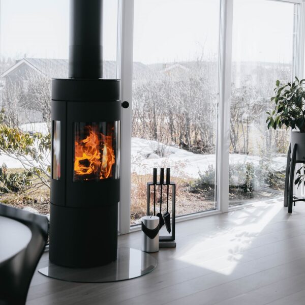 RAIS Viva L 120 Wood-Burning Stove - Lifestyle Image in Black with Glass Door and Side Glass