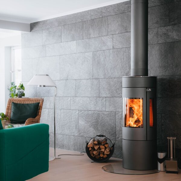 RAIS Viva L 120 Wood-Burning Stove - Lifestyle Image in Platinum with Steel Door and Side Glass