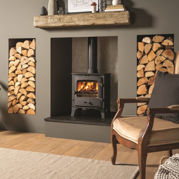 Stovax County 5 Wood-Burning and Multifuel Stove - Lifestyle Image in a Modern Fireplace with Log Stores