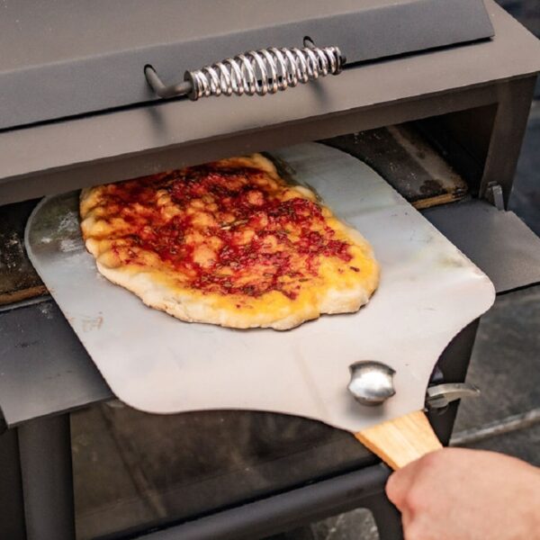 Esse Garden Stove with Pizza Oven - Pizza Peel Cooked Image - Wood-Burning Outdoor Stove with Built-In Pizza Oven