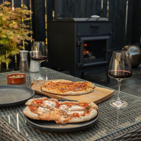 Esse Garden Stove with Pizza Oven - Pizza Table Lifestyle - Wood-Burning Outdoor Stove with Built-In Pizza Oven