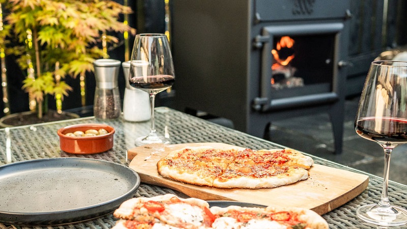 Esse Garden Stove with Pizza Oven - Landscape Lifestyle Image - Wood-Burning Outdoor Stove
