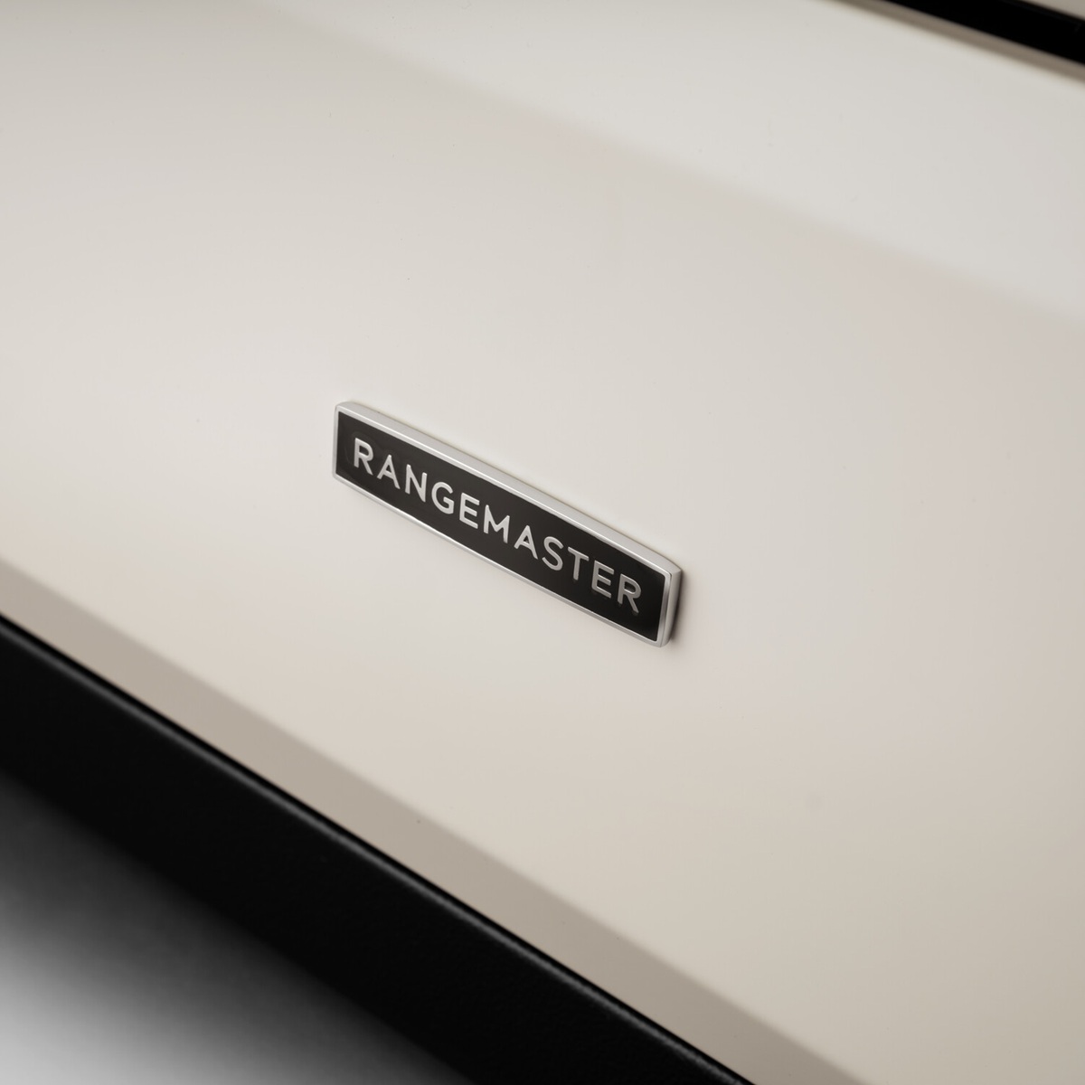 RangemasterClassic110-DF-PaleCream-BadgeDetail Rangemaster Classic 110 Next-Generation Range Cooker - Pale Cream with Chrome Trim - Dual Fuel - Badge Detail