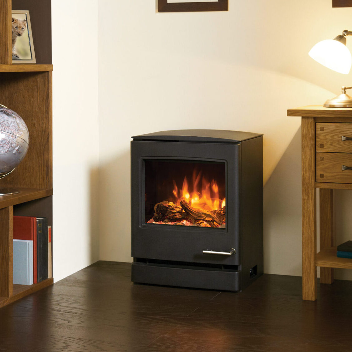 CL5 Electric Stove_5 Gazco Yeoman CL5 Electric fire on wooden floor and bookcase on left hand side