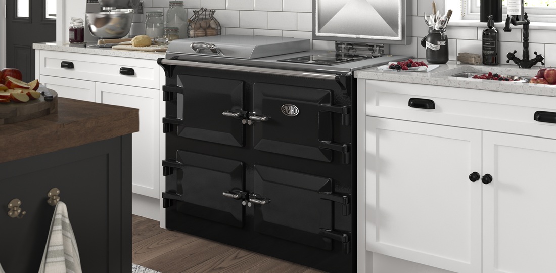 Everhot 110i in Black - Electric Range Cooker - Landscape lifestyle image in a white and dark wood kitchen.