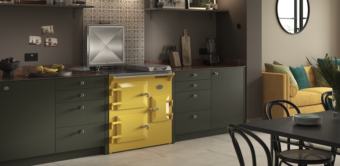 Everhot 90i in Mustard Yellow - Lifestyle image in dark green kitchen/living area.