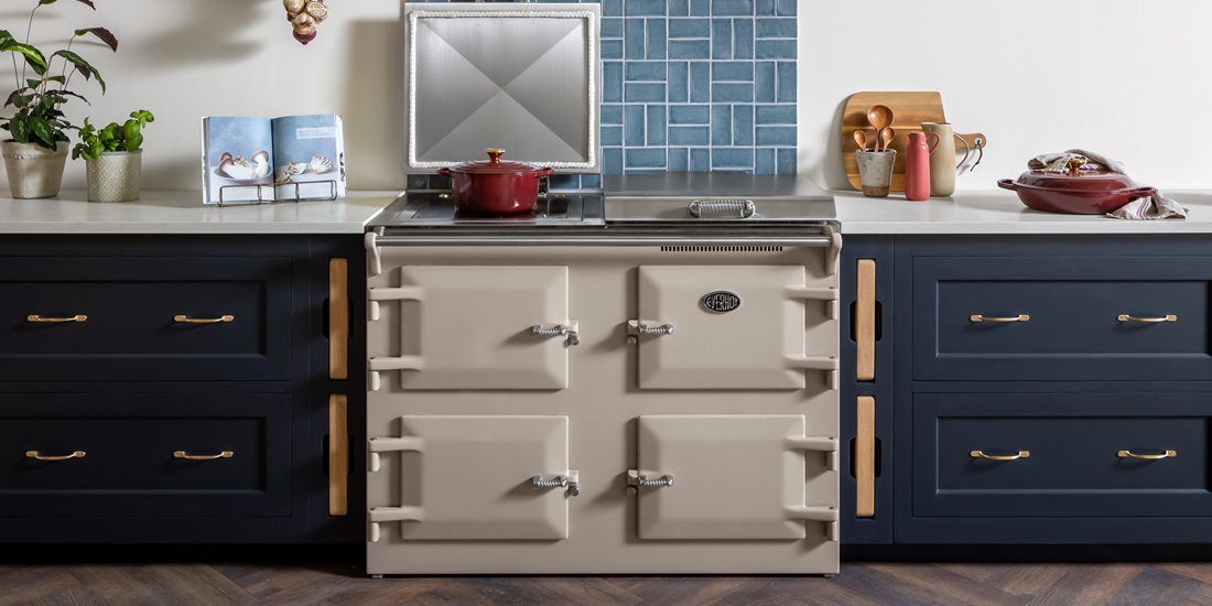 Everhot 120+ in Mushroom - Electric Range Cooker - Landscape lifestyle image in a navy blue kitchen setting.