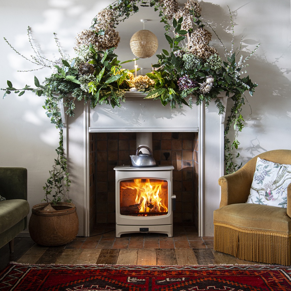 Charnwood Aire 700 Intelligent Stove in almond with floral fireplace